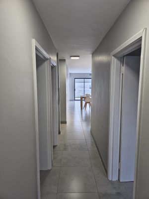 Hallway with doors on each side